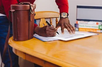 Person writing on paper