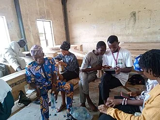 Students working together with a tutor
